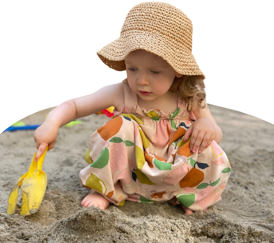 young child playing in the sand at our family day care rockdale