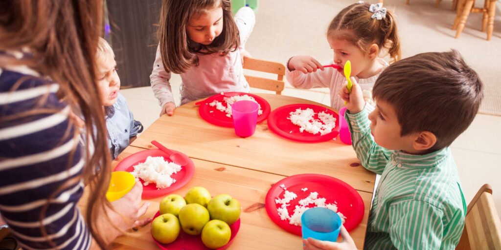 Children eating a nutritious meal at a daycare centre